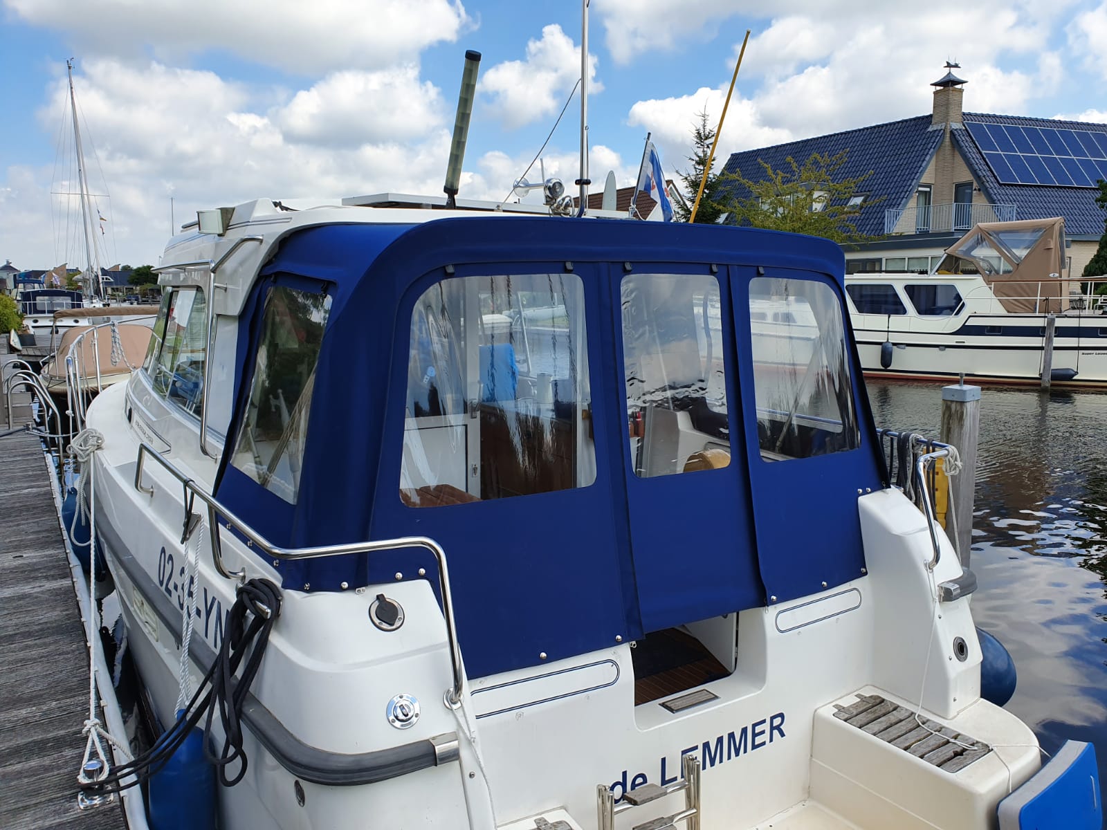 Rear tent on the back of a boat on the water