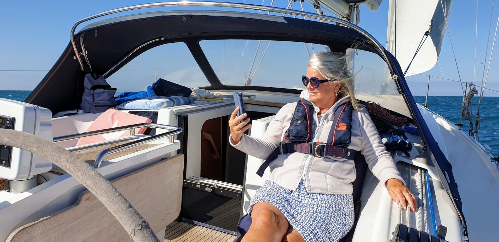 Tube captain Janneke takes photo on boat