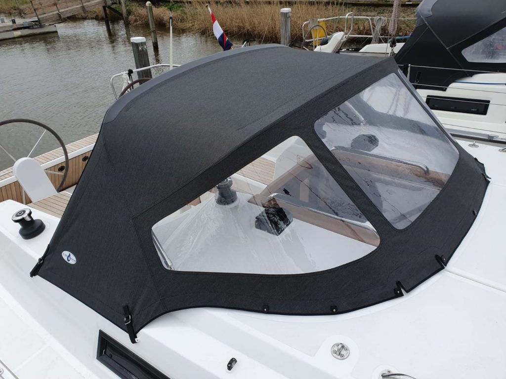 Tube cover gray on white boat in harbor on water