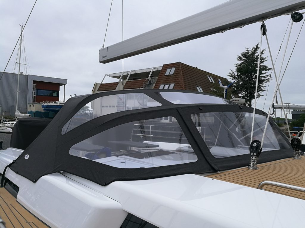 spray hood black on white boat in harbor